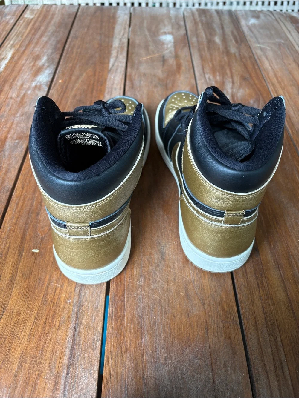 Air Jordan High-Top Sneakers in Black and Gold